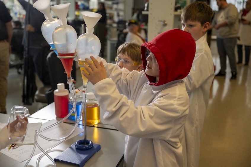 After making a prediction about how the fluid would behave, students worked in teams to test their hypothesis and observe what is happening.
