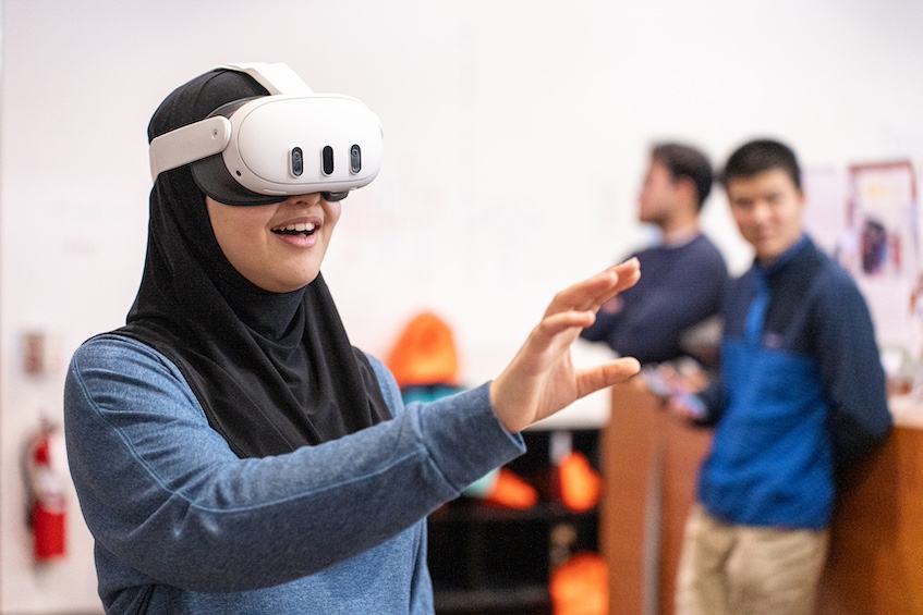 “The Immersive World of VR” — A festival attendee reaches out to experience the intersection of the virtual world and the real world with the Virtual Environments Group, an emerging technologies research lab at the Wisconsin Institute for Discovery. (Photo by Romulo Ueda Photography)