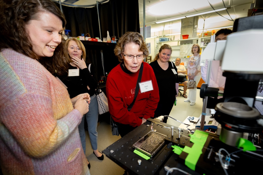 Postdoc Amani Gillette demonstrates the single-cell sorter.