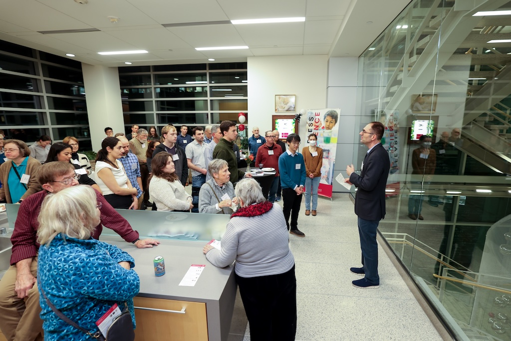 Josh Coon, the Thomas and Margaret Pyle Chair in Metabolism at the Morgridge Institute, offers opening remarks to guests before entering the lab spaces.