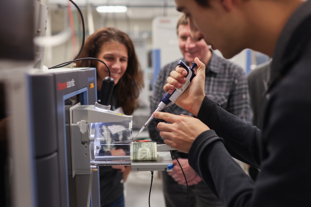 In this demo, guests observed how paper spray technology can quickly identify materials such as traces of cocaine on dollar bills.