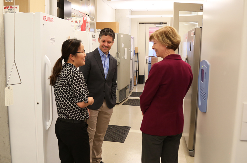 Jing Fan (left), an investigator in metabolism at Morgridge, with Dave Pagliarini (center), discusses how she integrates metabolomics and lipidomics approaches with biochemical, genetic, and computational tools to investigate metabolism. 