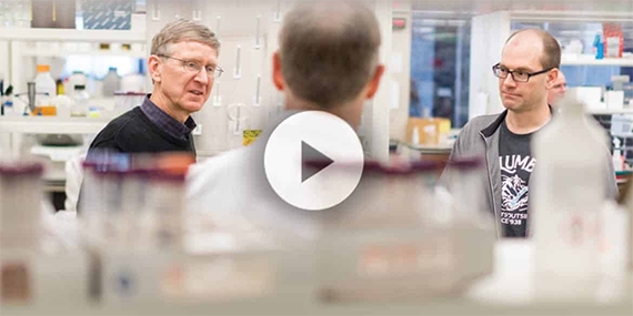Scientists talking in a lab